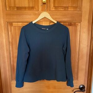 Puma:  blue crewneck with a zipper open back